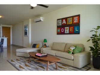 Stylish living room open plan with sectional sofa and ocean views PH Perlamar Casamar Panama