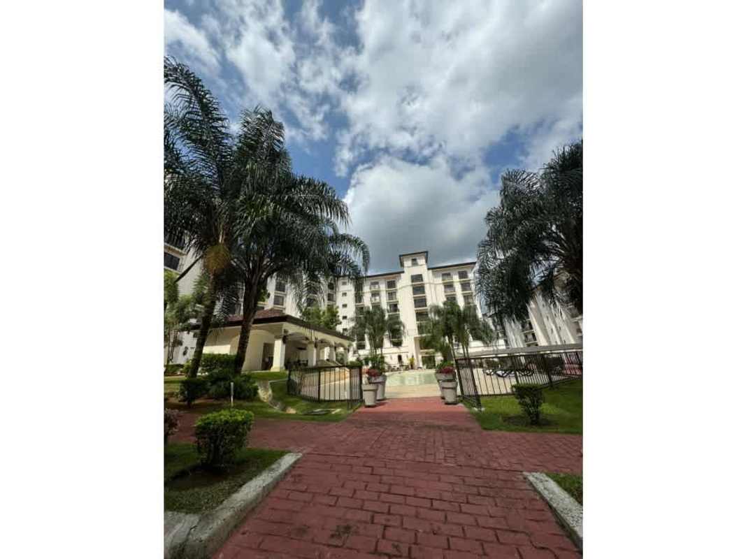 Condo exterior view with gardens and walkway at PH Embassy Village Clayton Panama