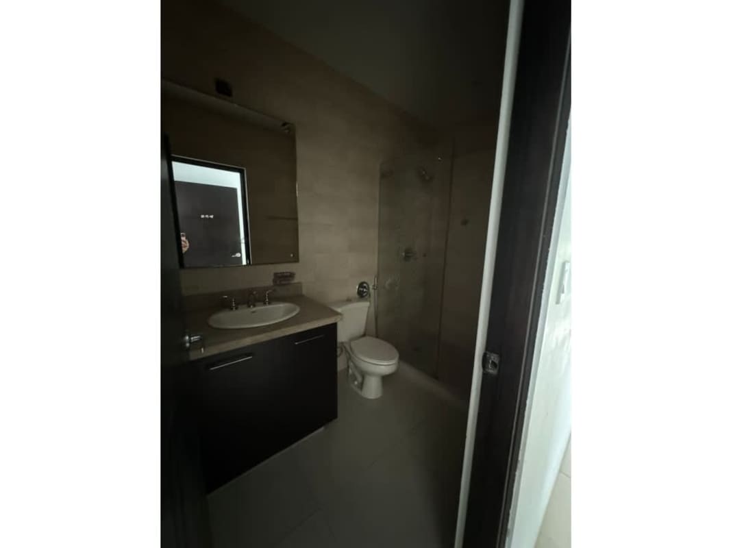 Modern bathroom with glass shower enclosure at PH Embassy Village Clayton Panama