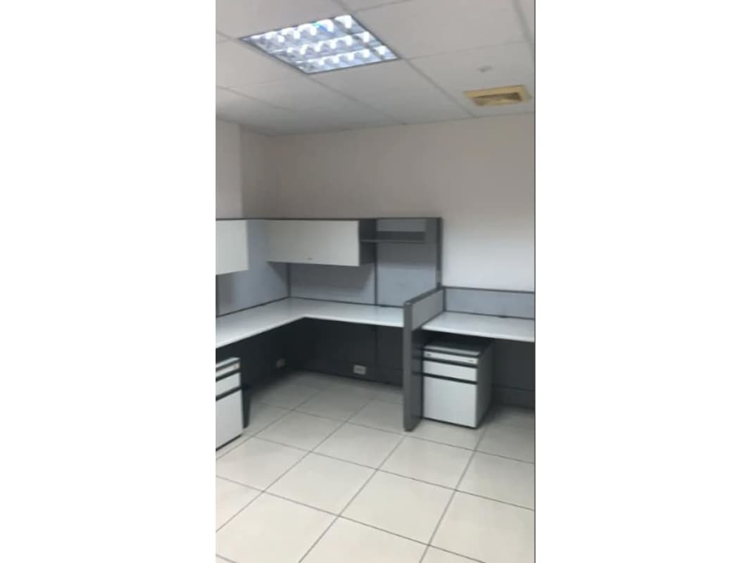 Functionally furnished office workspace with cubicles and tile flooring in PH Mar del Sur Via España Panama City