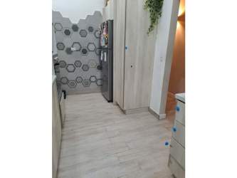 Kitchen with appliances, wood cabinets, hexagonal backsplash in Panama rental house Villa de las Fuentes