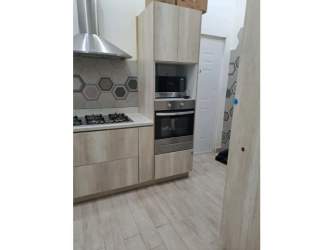 Covered patio terrace with garden view in furnished house Villa de las Fuentes Panama City rental