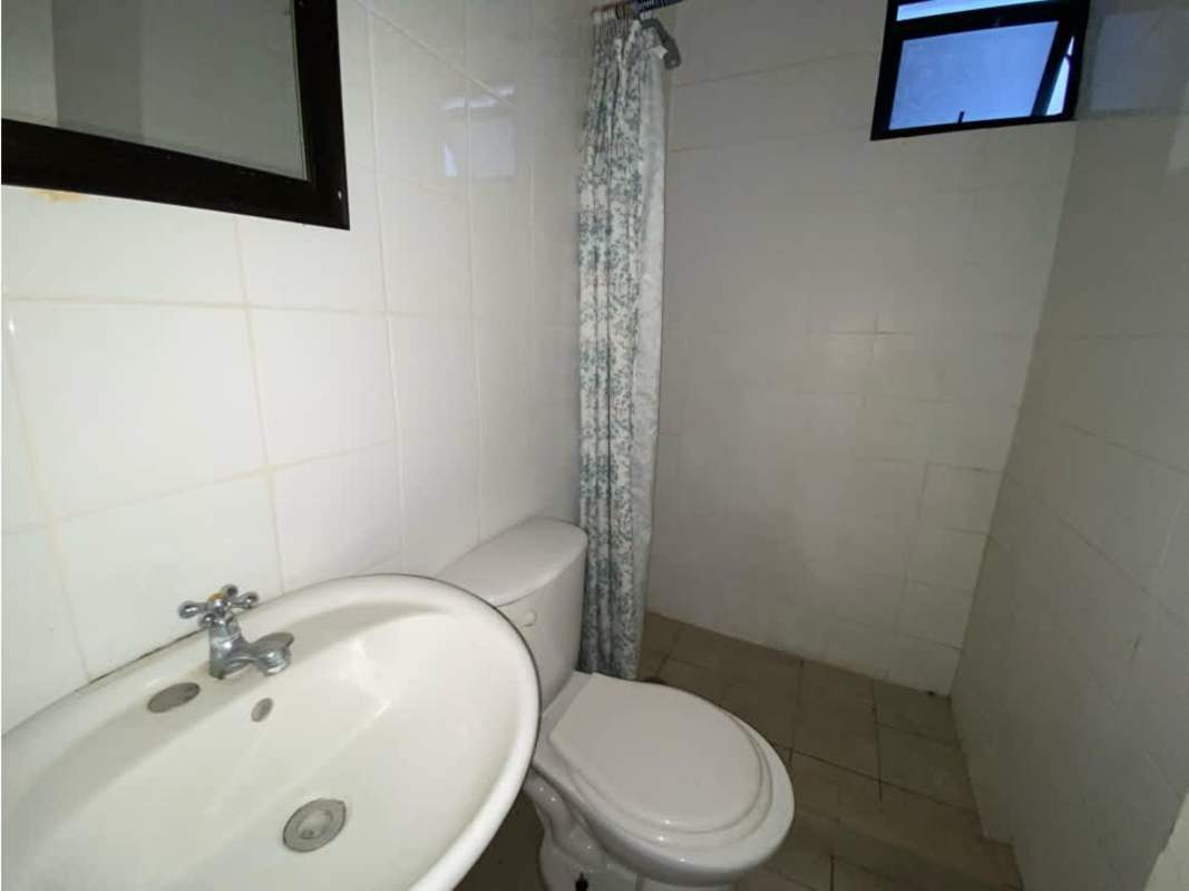 Modern kitchen granite countertop, white cabinets, range hood in Condado del Rey Panama