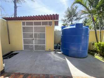 Heated swimming pool with Jacuzzi in landscaped garden beach house San Jose Panama