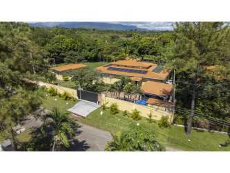 Bedroom with bunk beds, window light, wood floor in San Carlos beach home