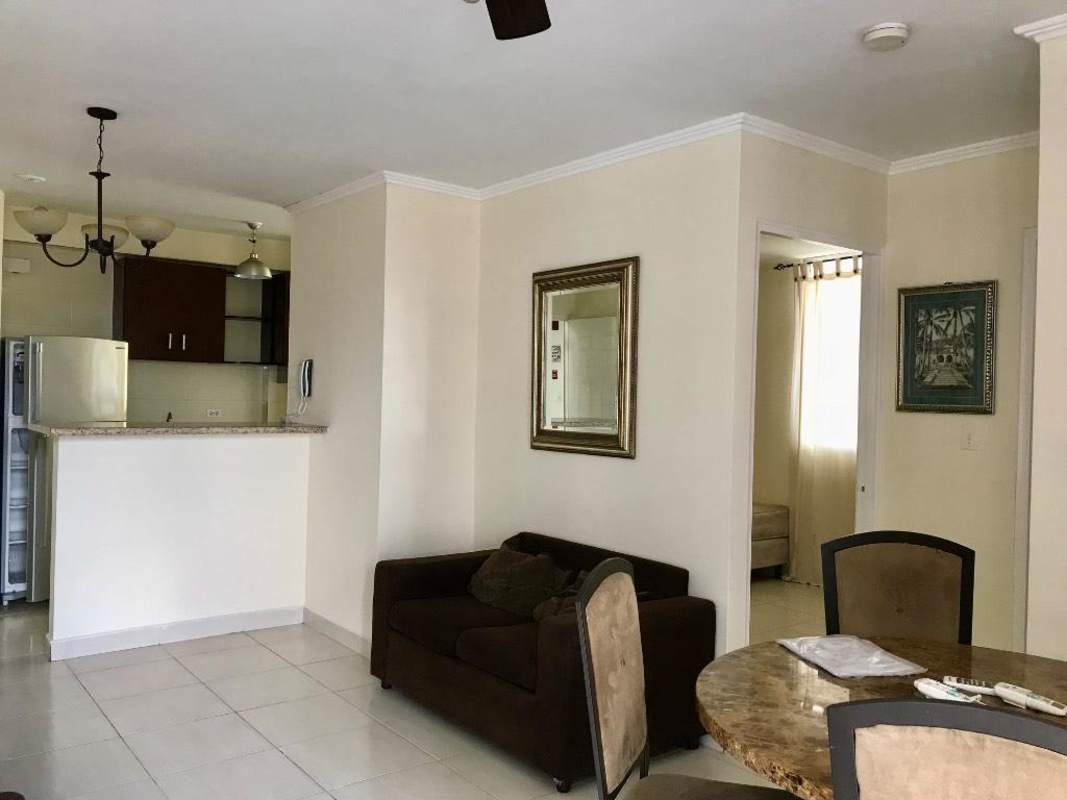 Second bedroom with closet neutral tile floors window in PH Parque Lefevre Panama affordable