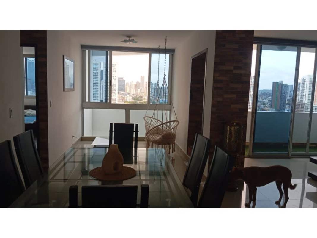 Living room with large windows, skyline view in PH Infinity Tower furnished apartment Panama City