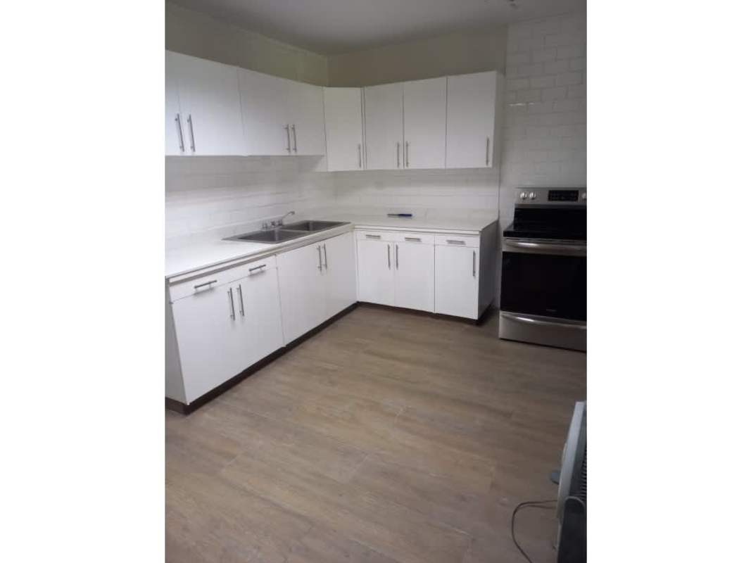 Large open tiled living and dining space with natural light in La Boca Panama rental