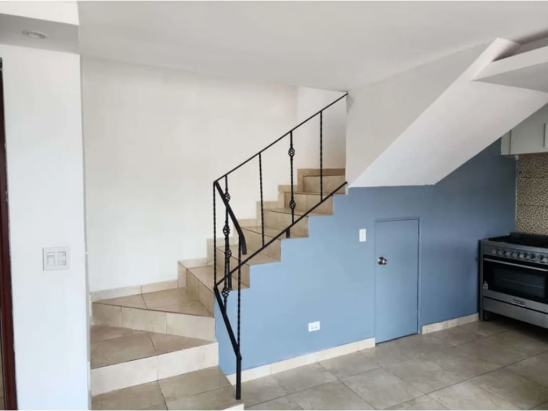 Apartment kitchen with tile backsplash, granite counters, appliances in PH Torres del Crisol II Panama City