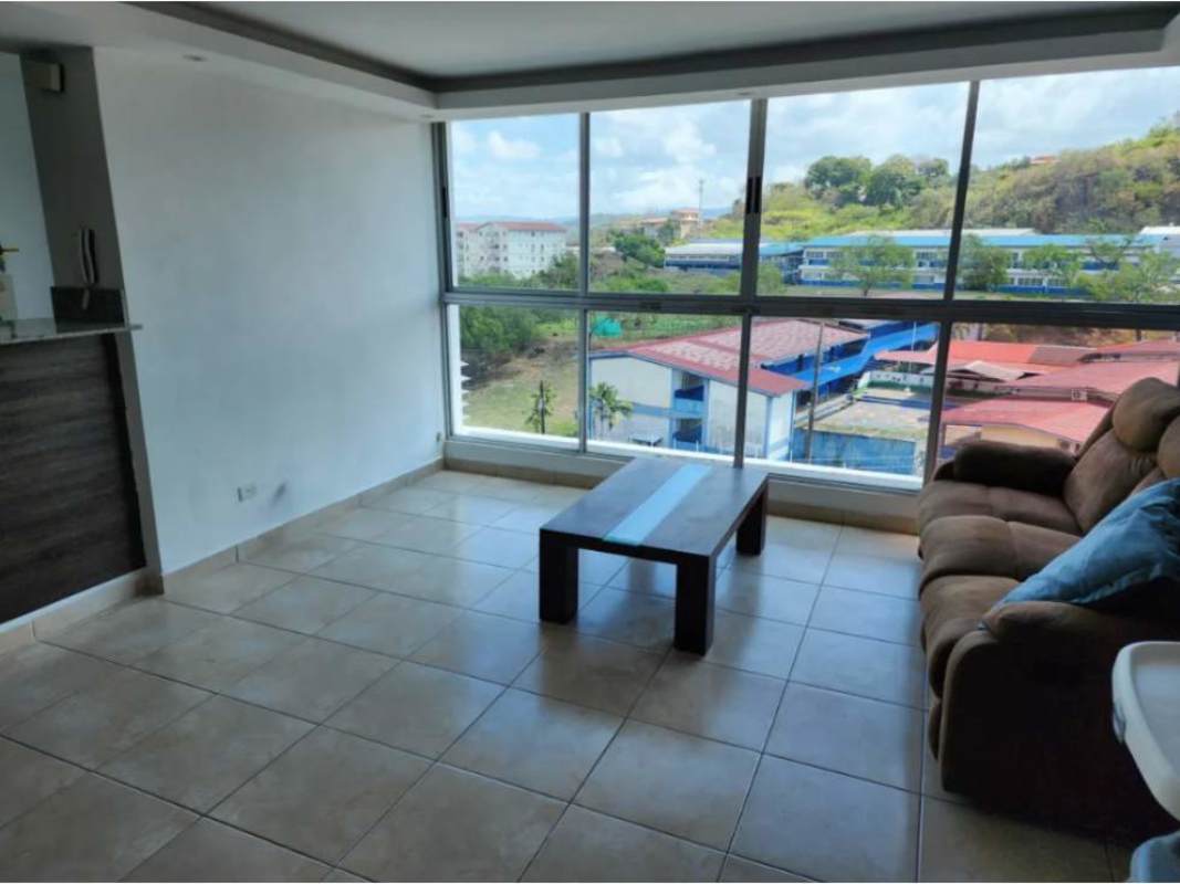 Bright modern living room with large windows and panoramic neighborhood views in PH Torres del Crisol II Panama City