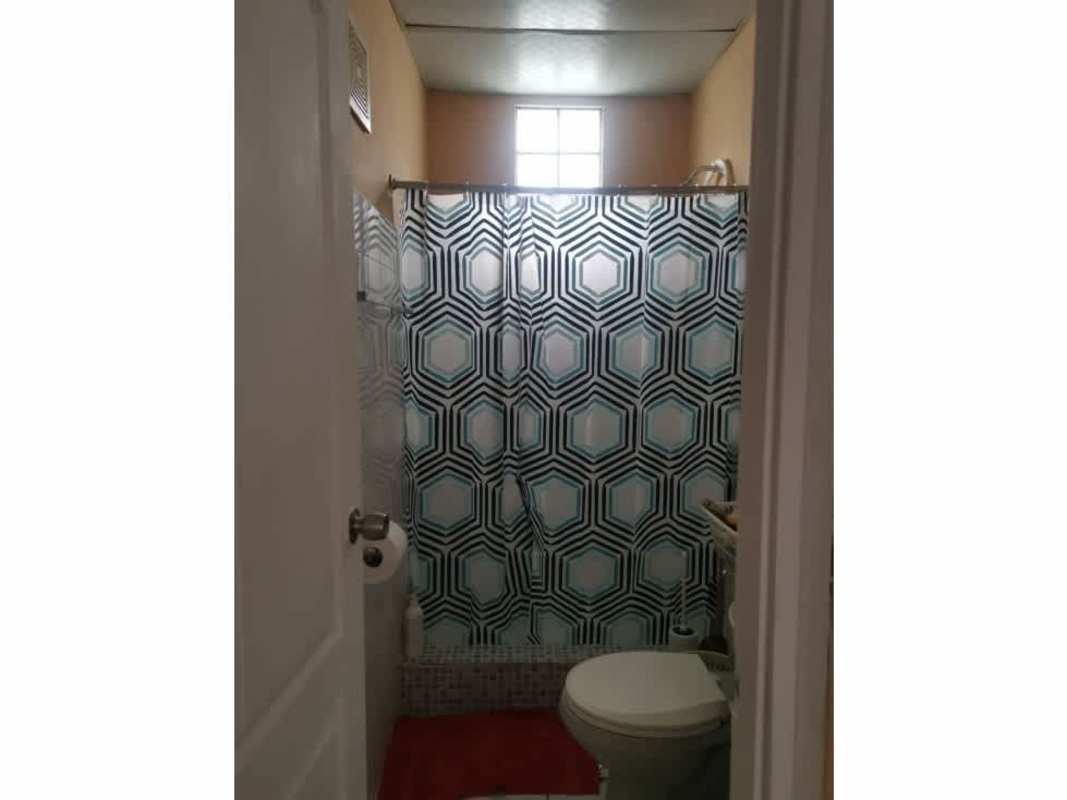 Compact bathroom with shower and window PH Aramis Carrasquilla Panama