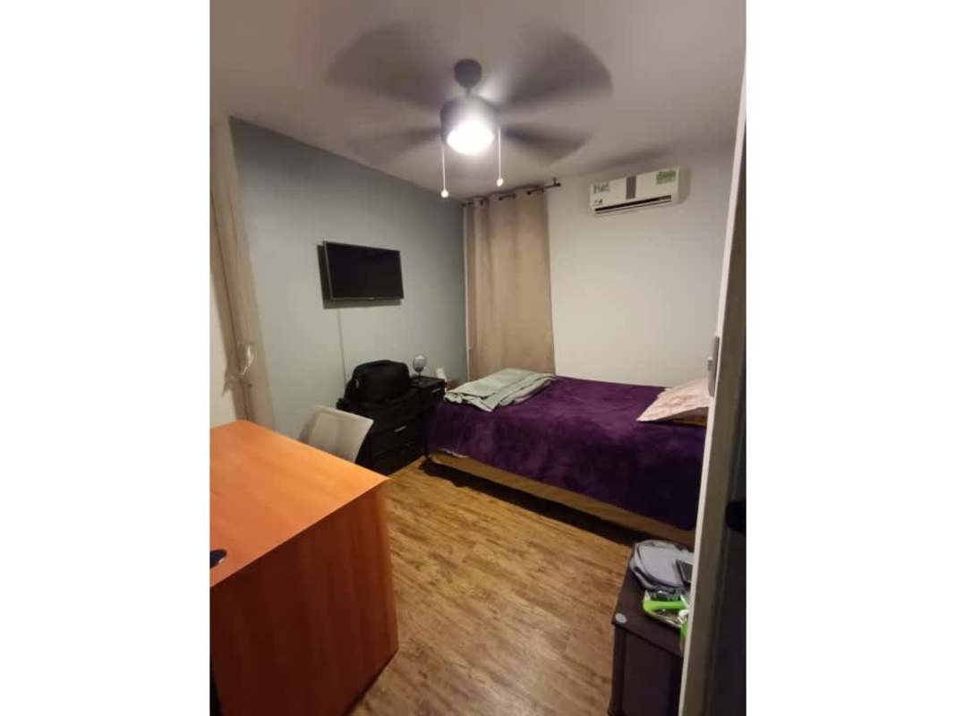 Living-dining with spiral staircase, brown sofa, modern decor PH Torre Del Rey Hato Pintado Panama