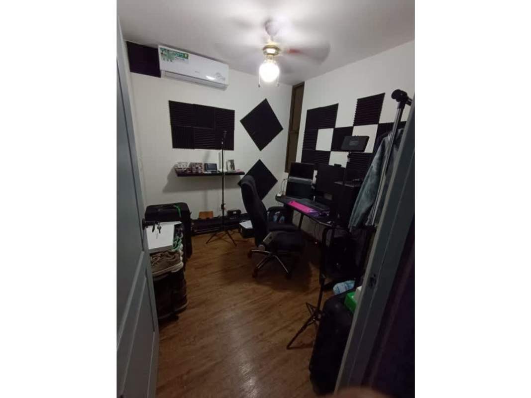 Outdoor pool with mosaic dolphin tiles and tropical plants PH Torre Del Rey Panama