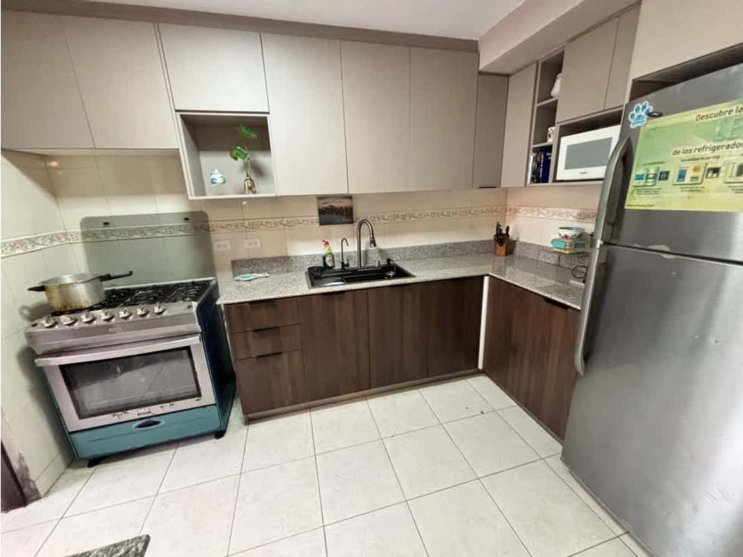 Kitchen with granite countertops, gas stove, appliances in furnished Dorado Lake Condado del Rey Panama home rental