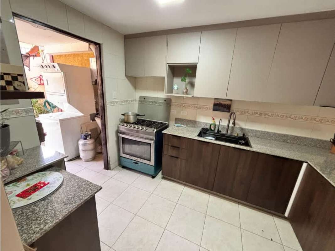 Interior staircase with metal railing, tile steps, natural light window Dorado Lake property Panama