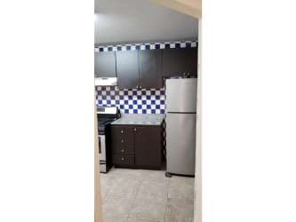 Kitchen backsplash checkered tiles dark cabinets pantry Edificio Toledo Panama