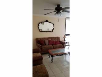 Bathroom with tiled walls, walk-in shower, vanity and mirror in Edificio Toledo Panama rental