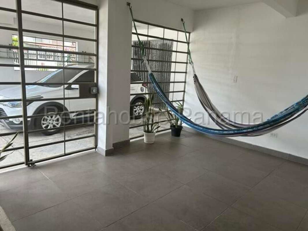 Spacious living room with dining area, terrace access, tiled floors in family home Chanis Panama
