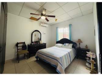 Bright bedroom with window, closet space in David Chiriquí La Fontana