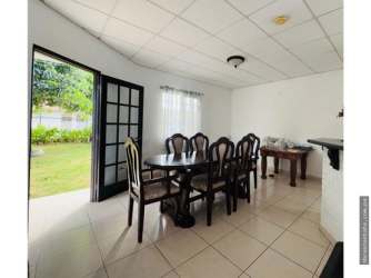Dining area with French doors to patio garden in Chiriquí house