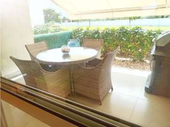 Open plan kitchen and living room in furnished PH Las Islas Punta Barco Panama