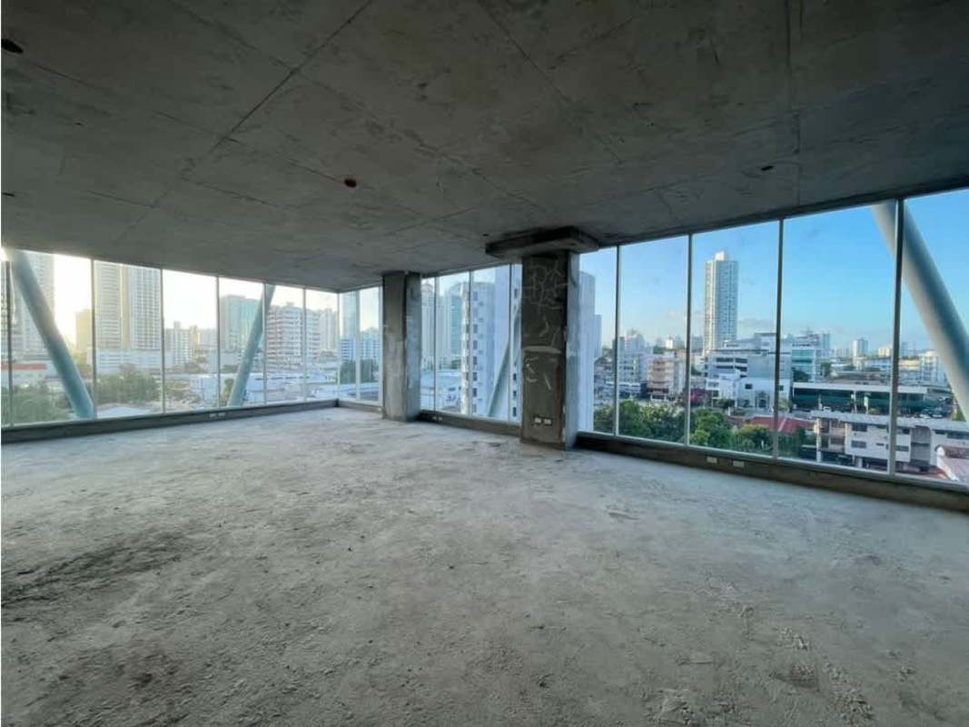 Unfinished open commercial space with exposed ceilings and large windows at Office 77 Coco del Mar Panama