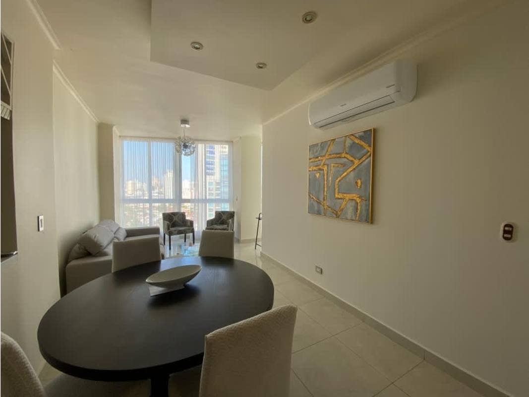 Modern living and dining area with panoramic city views in PH The Cosmopolitan San Francisco Panama City