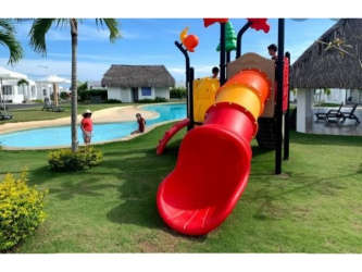 Playground area with slides and play structures in Ibiza Beach Residences Rio Hato Panama