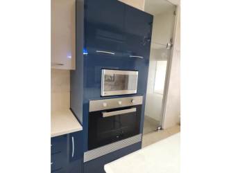 Tall kitchen cabinet with pull-out shelves blue and white design PH Roca Marina Panama