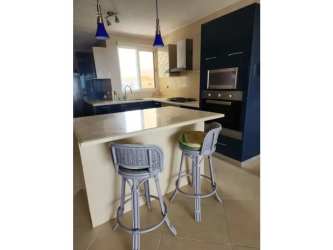 Minimalist empty walk-in closet with white built-in shelves in PH Roca Marina Panama