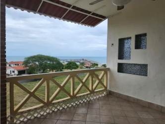 Living room with sliding doors to balcony in beachfront condo Vista Mar Panama