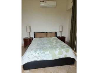 Balcony terrace with wooden railing ocean in background PH Roca Marina Panama