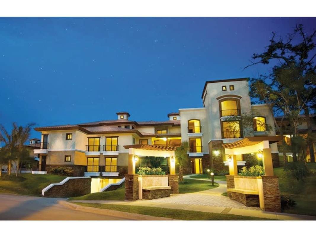 Spacious kitchen with granite counters wood cabinets full appliances Embassy Club Garden Clayton Panama Hola Realty