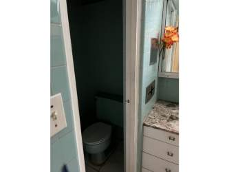 Bathroom with granite countertop and blue tiles house for sale El Cangrejo Panama