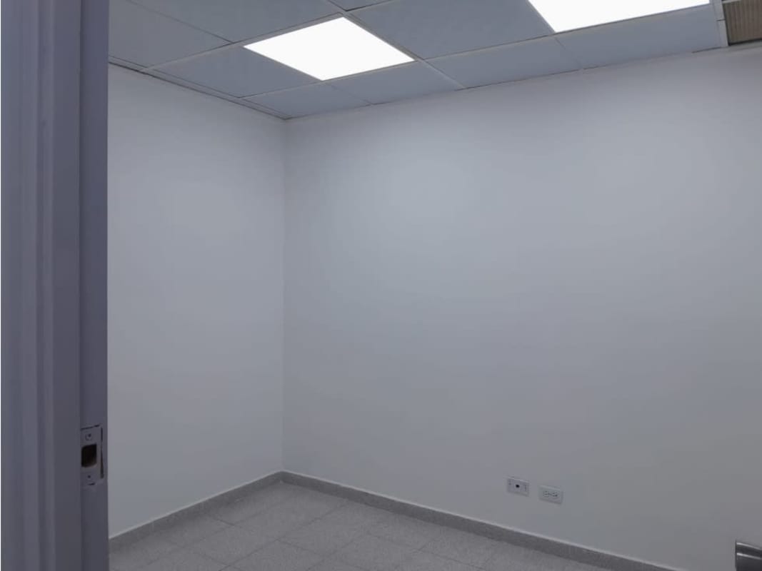 Common area hallway access with tile floors and neutral color at Royal Center office Panama