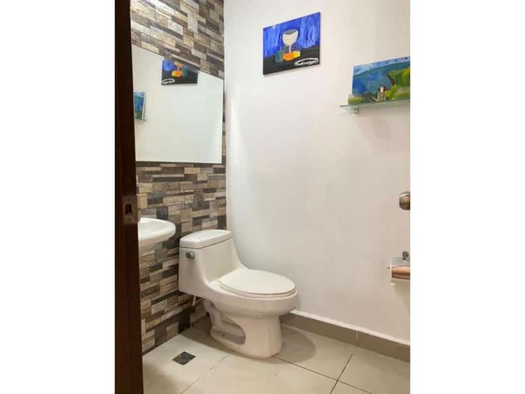 Bathroom with tile walls, glass shower door, and vanity in PH Terrwind Panama