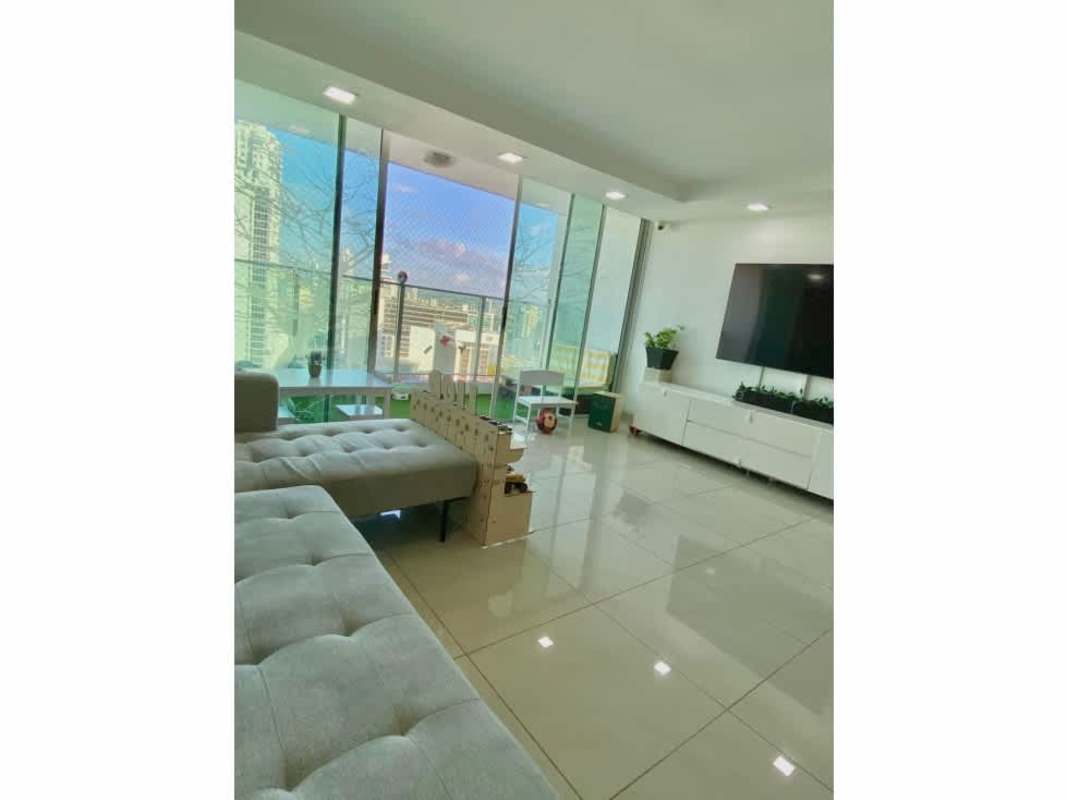 Spacious living room with large windows and city skyline view in PH Terrwind