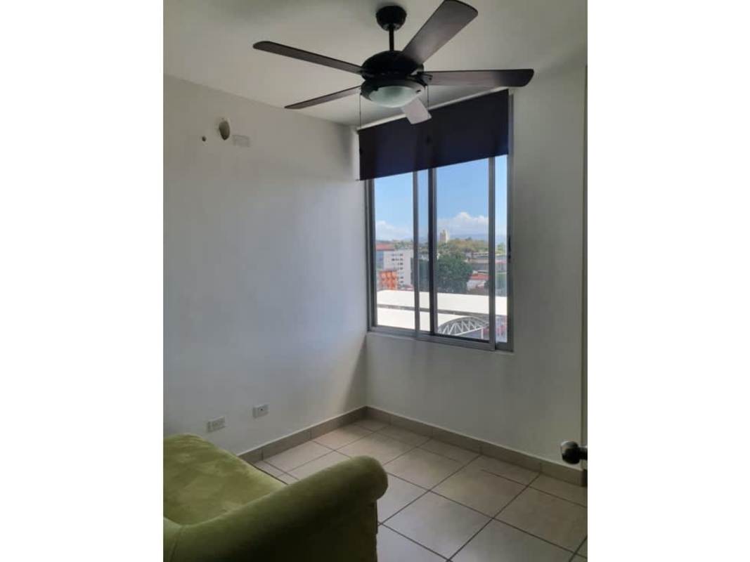 Living room with exposed brick wall and ceiling fan PH Lefevre 75 Parque Lefevre Panama