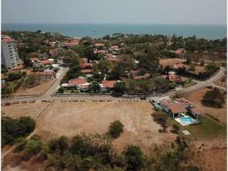 Aerial of Punta Barco Village with private beach path and community facilities like pool and clubhouse