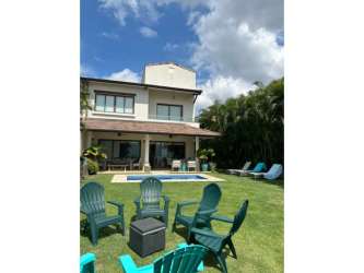 Terrace overlooking Pacific Ocean with tropical green lawn at Casamar San Carlos villa for sale