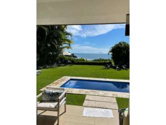 Modern Mediterranean villa with private pool, garden, and outdoor lounge in Casamar San Carlos beachfront