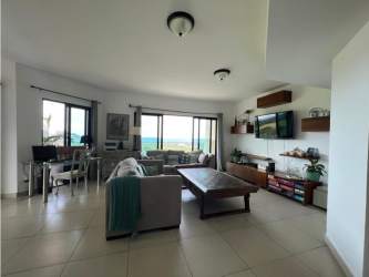 Modern bathroom with bathtub, dual vanities, large window in luxury Vistamar beachfront condo Panama