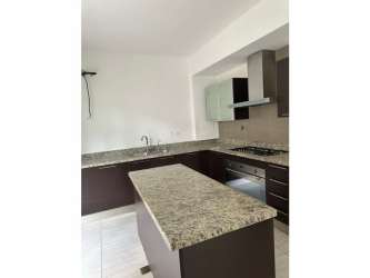 Modern granite kitchen island with appliances in PH Nativa Panama Pacifico