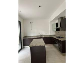 Spacious master bedroom with garden view and balcony in PH Nativa Panama Pacifico