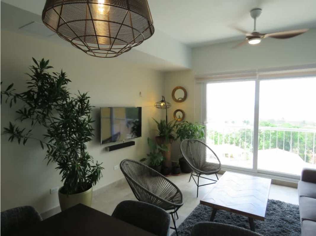 Kitchen with granite countertops and stainless appliances in Tucan Country Club Golf apartment