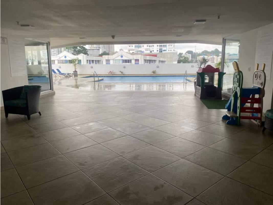 Multi-use room with foosball table and seating at PH Riverside Panama City