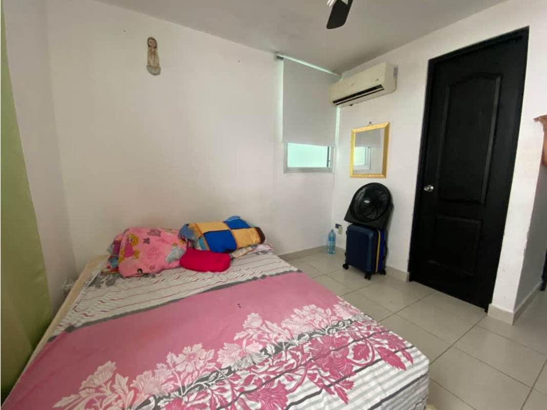 Bedroom with air conditioning, ceiling fan, and floral bedspread PH Riverside Panama