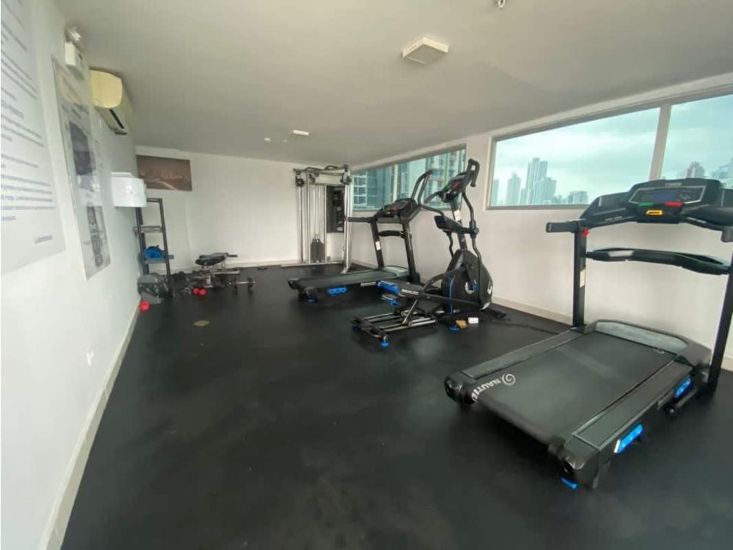 Gym with equipment and skyline views in PH Riverside Parque Lefevre Panama