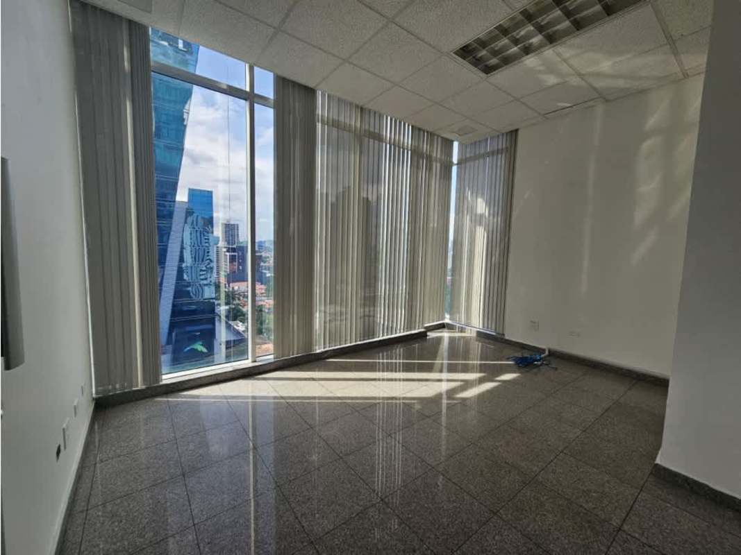 Modern office with floor-to-ceiling windows and vertical blinds in Torre Global Bank Panama City