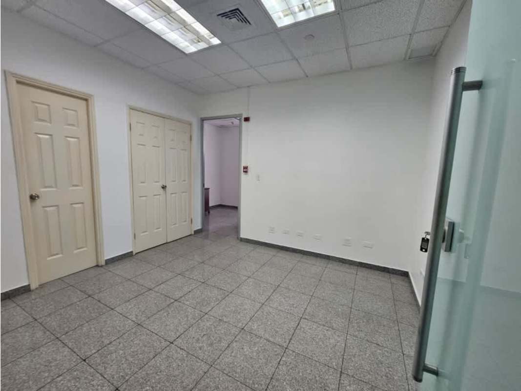 View of modern bright office cube space with tile floors in Torre Global Bank Panama City